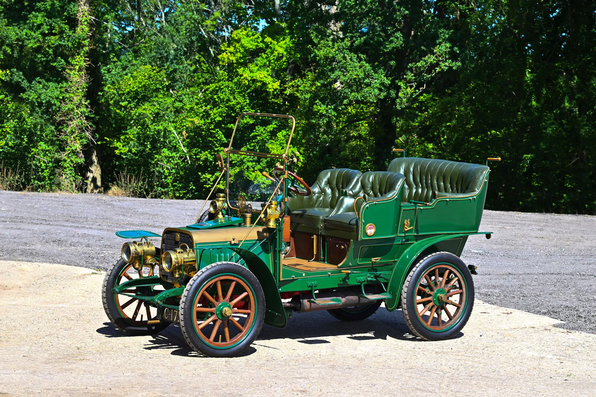 Green buttoned leather seats of the 1904 Darracq Swing-Seat Tonneau offered by Bonhams